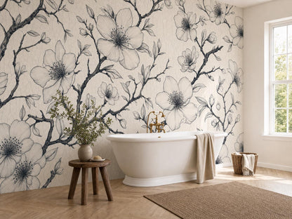 Bright bathroom corner with the ink blossom wallpaper, a white tub, wooden stool and towels