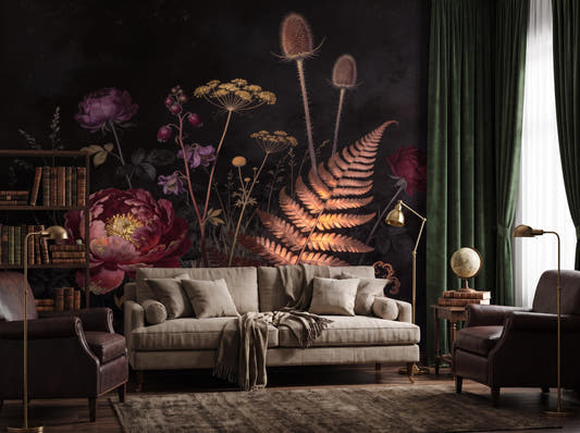 Dark botanical wallpaper with a crimson peony and copper fern behind a grey sofa and brass lamp