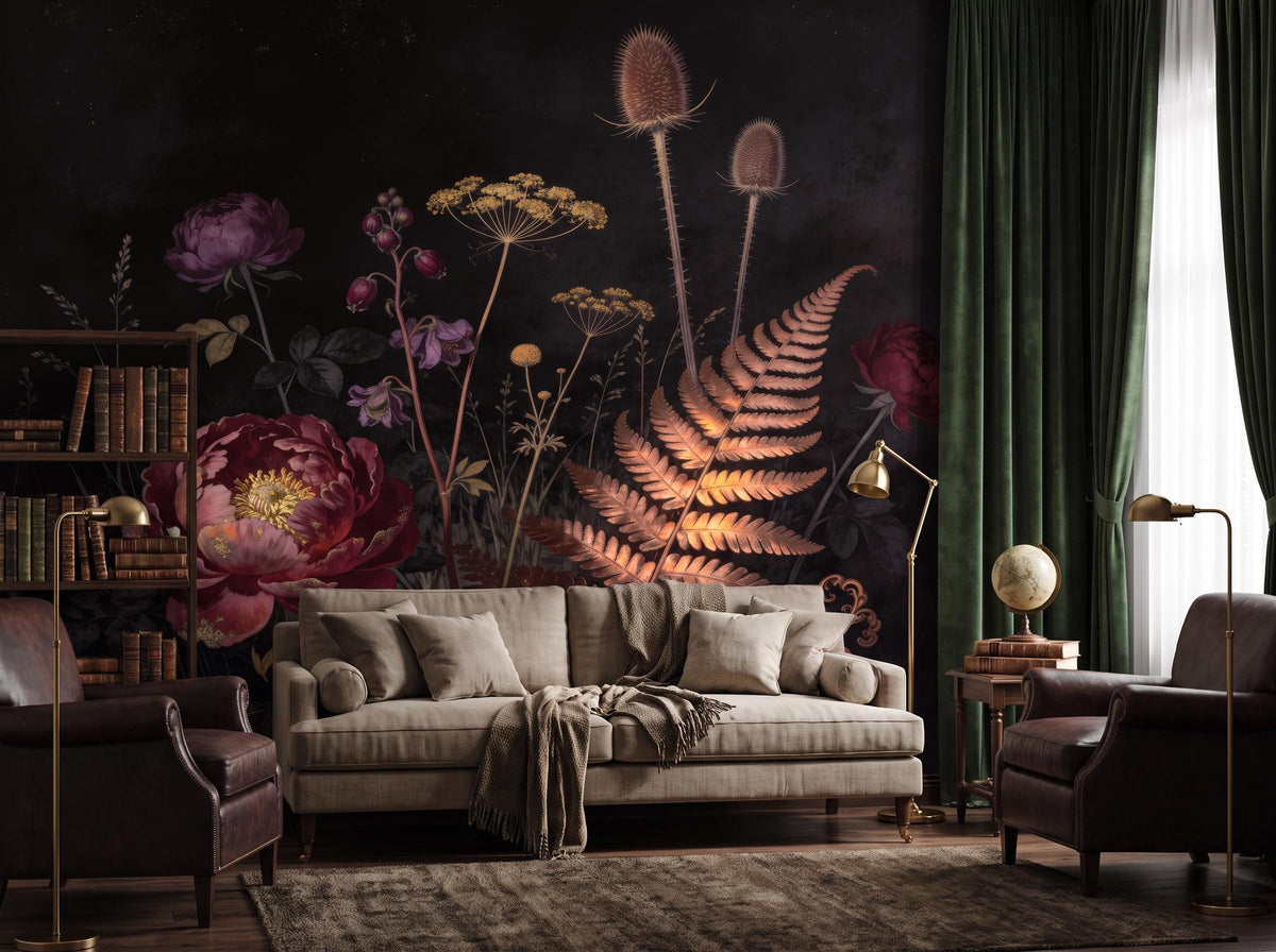 Dark botanical wallpaper with a crimson peony and copper fern behind a grey sofa and brass lamp