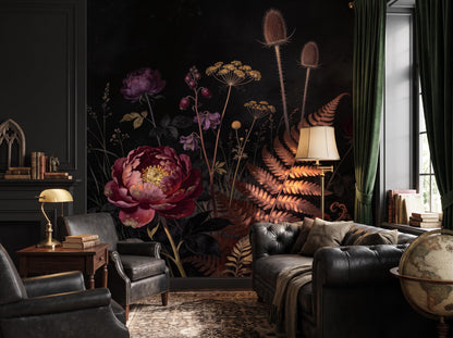 The dark botanical wallpaper across a room, with a leather sofa, bookshelves and a globe