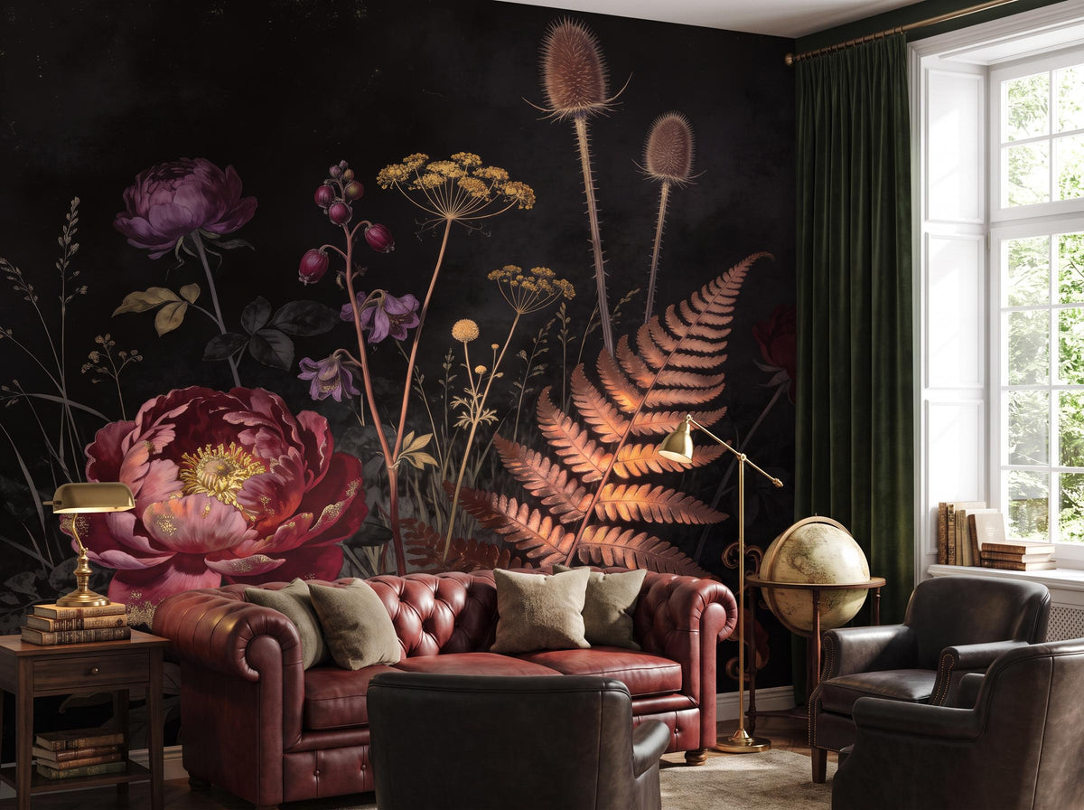 Dark botanical wallpaper beside a bright window, with an oxblood chesterfield and a brass lamp