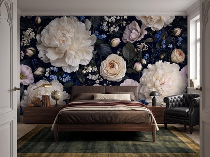Wide bedroom with the dark peony wallpaper, a wooden bed, leather chair and patterned rug
