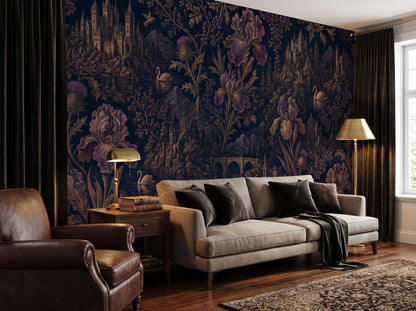 The gothic floral wallpaper across a living room wall, with a grey sofa and a table lamp