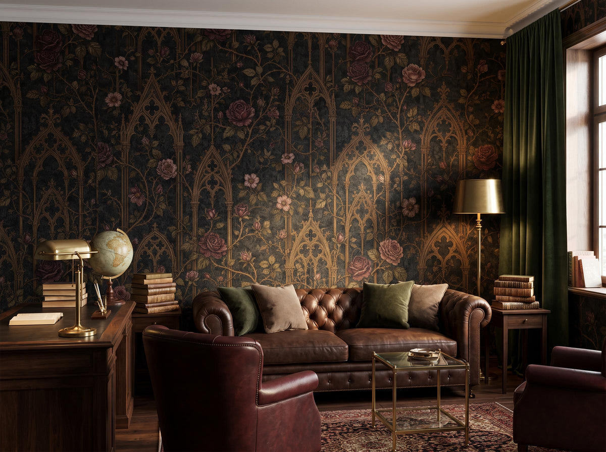 Dark gothic rose damask wallpaper behind a brown leather chesterfield sofa, with a desk, globe and brass lamp