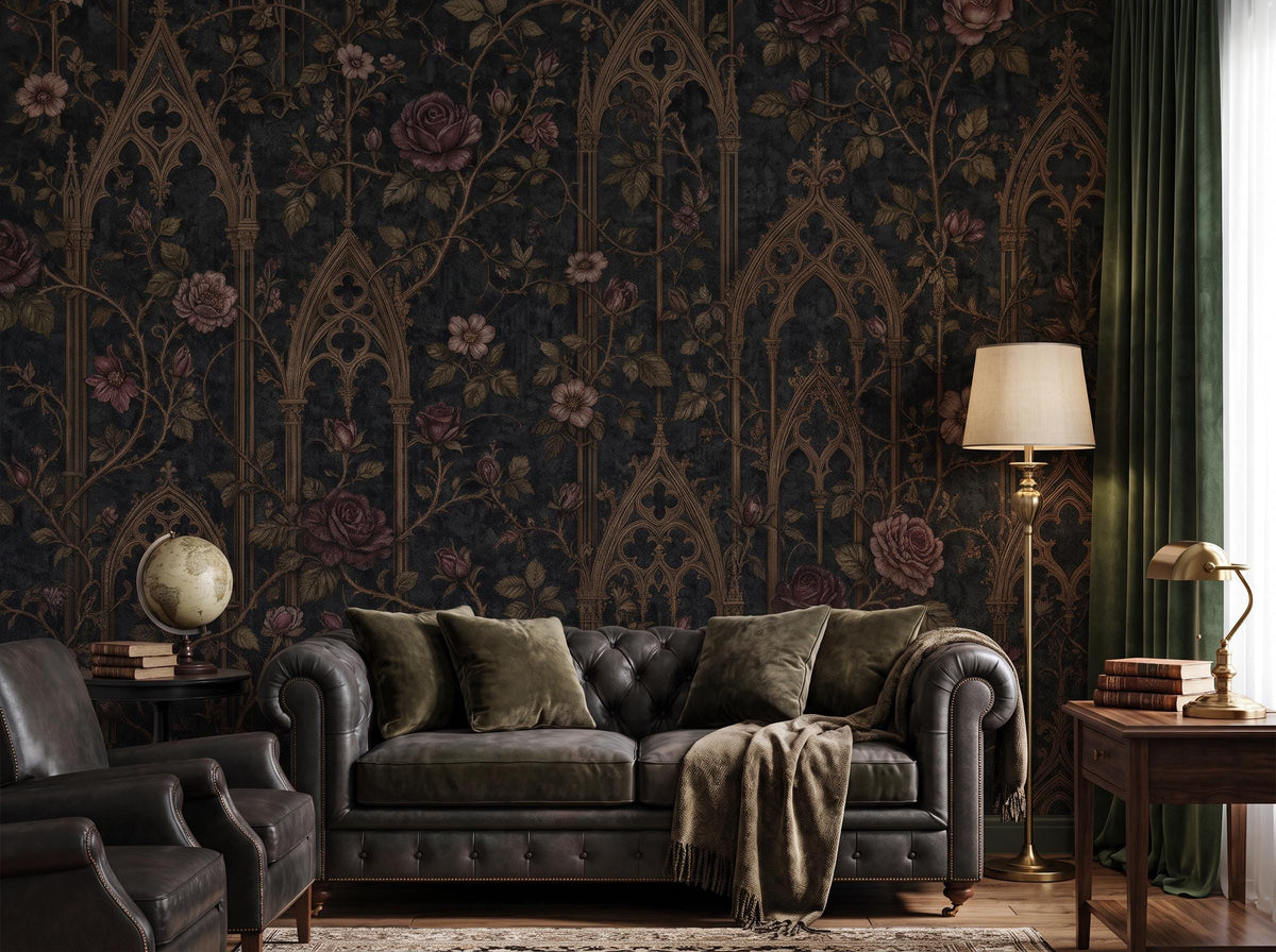 The gothic arch and rose pattern across a study wall, with a dark chesterfield sofa and a table lamp