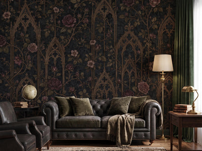 The gothic arch and rose pattern across a study wall, with a dark chesterfield sofa and a table lamp