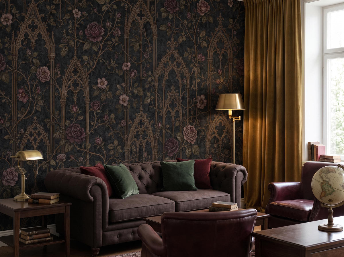 Gothic rose wallpaper beside a curtained window, with a leather sofa, stacked books and a brass floor lamp