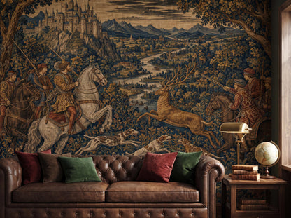 Medieval tapestry hunt mural behind a brown leather chesterfield sofa with jewel-toned cushions