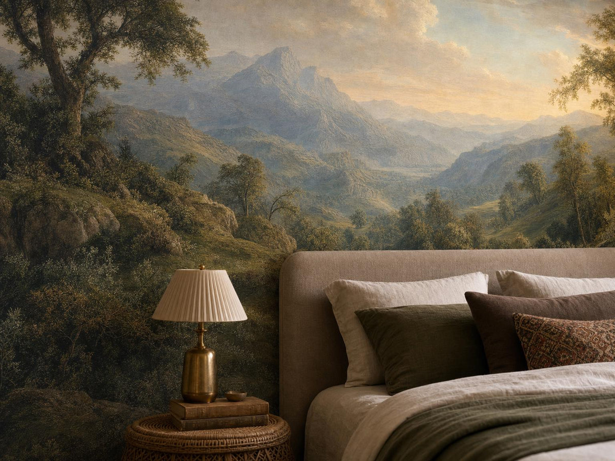 Close view of the valley, distant peak and cream sky in the mural, beside a brass bedside lamp