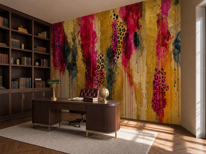 Corner of a panelled study with the gold and magenta wallpaper, bookshelves and a desk