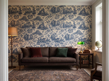 Wide room with the antique blue toile wallpaper, a leather sofa, floor lamp and Persian rug