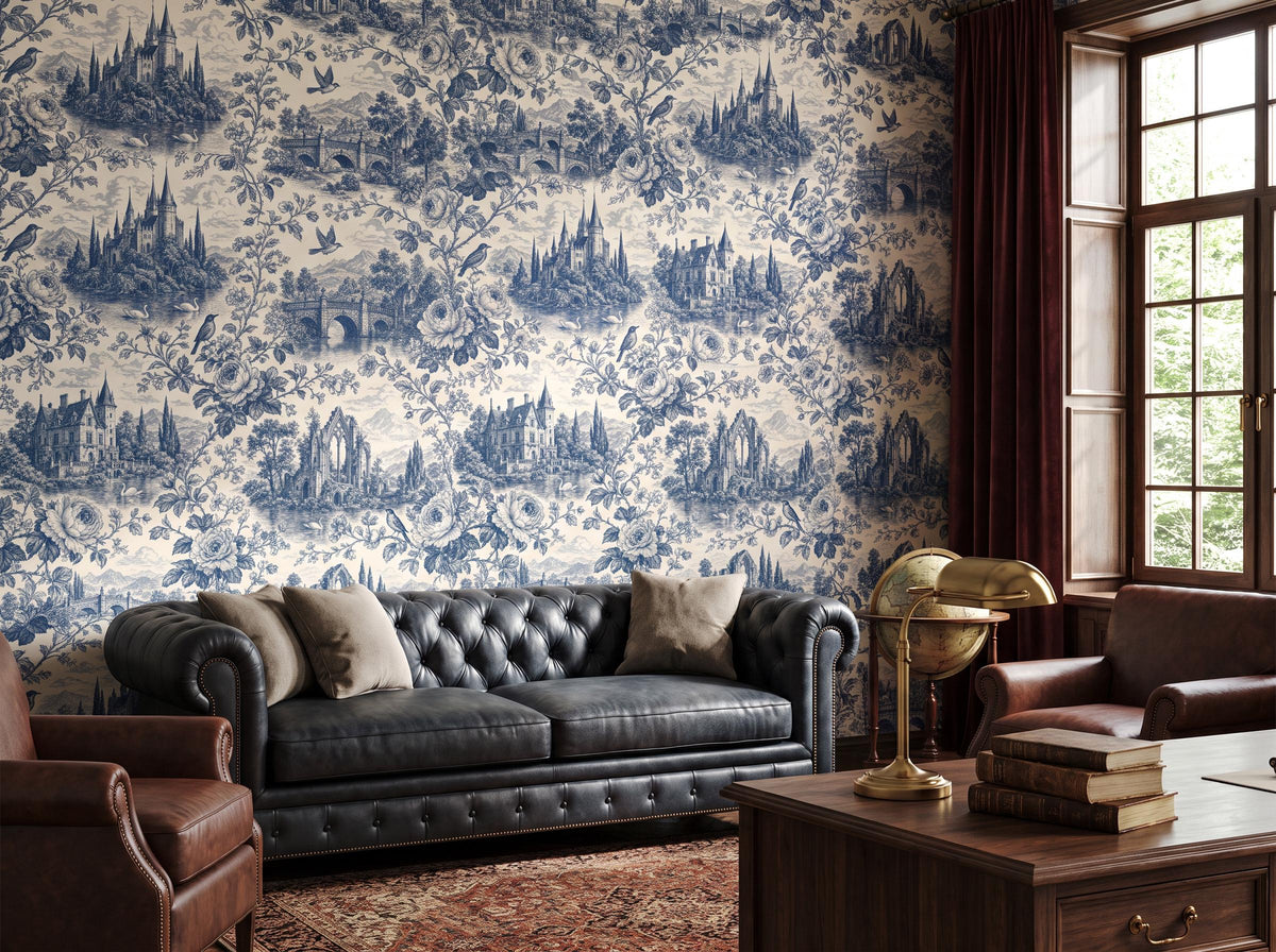 Blue toile wallpaper beside a leaded window, with a black leather sofa, books and a globe