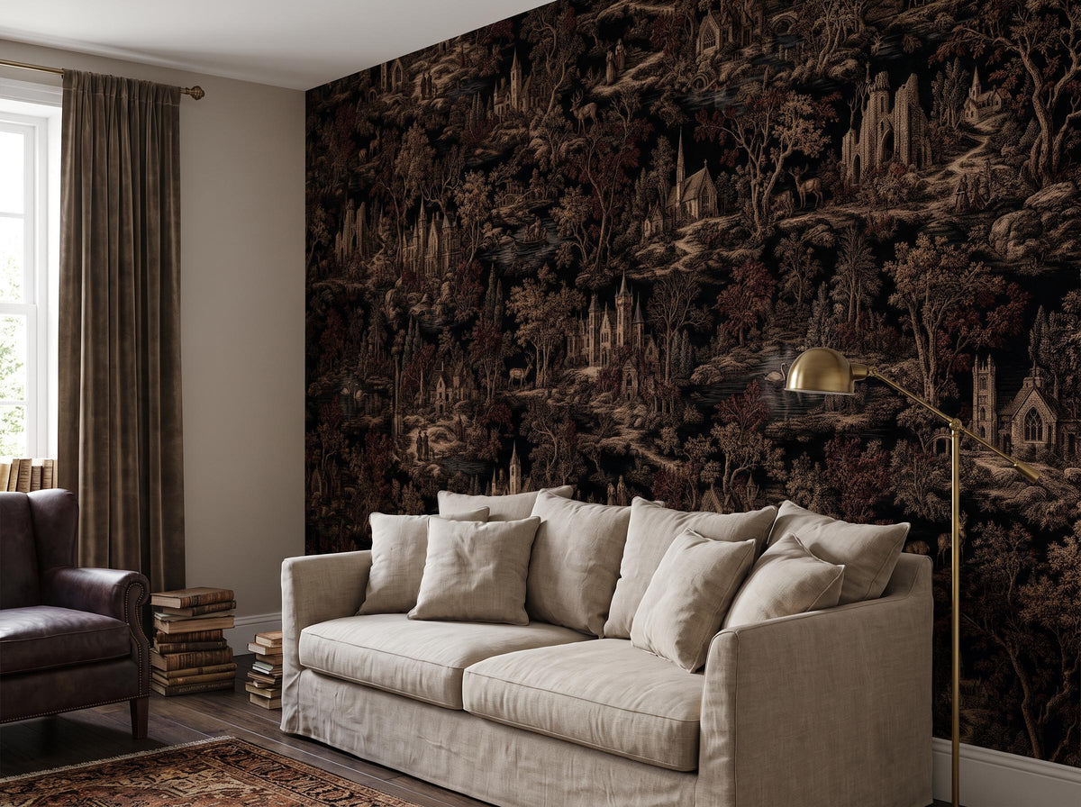 The sepia toile wallpaper across a living room wall, with a pale sofa and a brass wall light