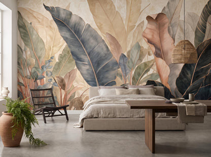 Oversized ivory and blue-grey banana leaf mural behind a low bed, with a black spindle chair and a woven pendant