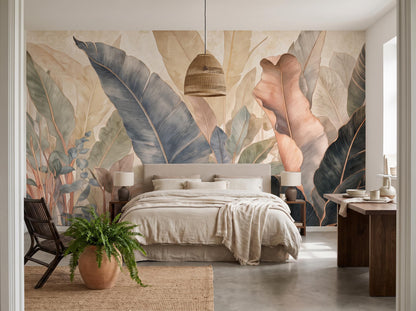 Wide bedroom view of the tropical leaf mural with a jute rug, fern and rattan pendant