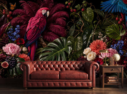 Crimson macaw mural on a black ground behind a tan leather chesterfield sofa