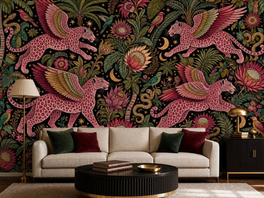 Pink winged leopard wallpaper on black behind a cream sofa with burgundy and green cushions