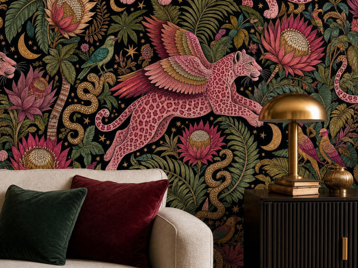 Close view of a winged pink leopard, golden snake and protea blooms beside a brass lamp