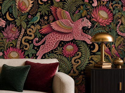 Close view of a winged pink leopard, golden snake and protea blooms beside a brass lamp